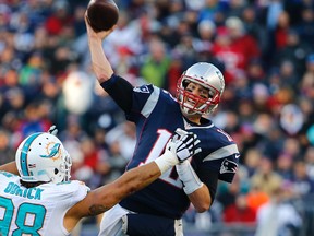 New England Patriots quarterback Tom Brady throws the ball over Miami Dolphins defensive tackle Jared Odrick during the second half against the Miami Dolphins at Gillette Stadium. (Winslow Townson/USA TODAY Sports)