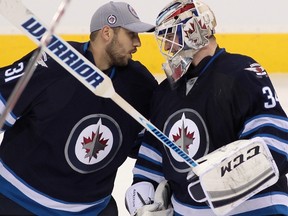 Michael Hutchinson, right, has started four of the last five games for the Winnipeg Jets, wrestling the No. 1 job away from Ondrej Pavelec.