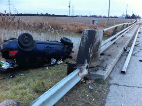 Four people were injured after a vehicle struck a guardrail on Kimball Rd. south of Langstaff Line Saturday afternoon. VICKI GOUGH / THE CHATHAM DAILY NEWS