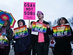 Protesters demonstrate against Bill 10 during the Alberta Legislature's Christmas light up event in Edmonton, Alta., on Thursday, Dec. 4, 2014. The controversial bill, which deals with student-led Gay-Straight Alliances, was put on hold for more consultation. Codie McLachlan/Edmonton Sun/QMI Agency