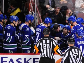 Vancouver Canucks forward Jannik Hansen (36) is attended to on the bench during the second period against the Calgary Flames at Rogers Arena. (Anne-Marie Sorvin-USA TODAY Sports)