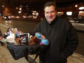 Ryan Dowd operates a service called Cravers.  For a fee, he will deliver various items from 5 p.m. to 5 a.m., which means he delivers lots of burgers, Slurpees, and baby care items. (Chris Procaylo/Winnipeg Sun/QMI Agency)