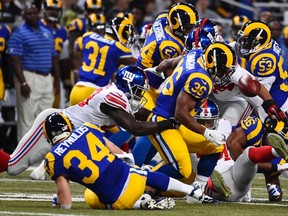 St. Louis Rams running back Benny Cunningham (36) fumbles the ball on a punt return against the New York Giants during the first half at the Edward Jones Dome. (Jasen Vinlove-USA TODAY Sports)
