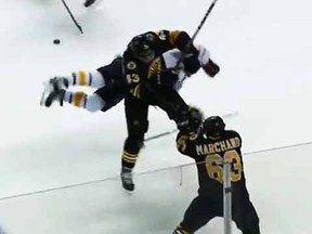 A screen grab shows Bruins Matt Bartkowski destroying Sabres' Brian 
Gionta with a big hit Sunday night.