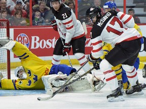 Canada’s #17 Connor McDavid shoots on Sweden’s goaltender #1 Samuel Ward during third period pre-tournament IIHF hockey at the Canadian Tire Centre in Ottawa on Sunday, Dec. 21, 2014. (Matthew Usherwood/QMI Agency)