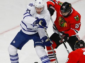 Maple Leafs' James van Riemsdyk battles Chicago Blackhawks' Johnny Oduya on Dec. 21. (USA Today Sports)
