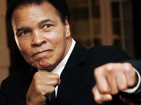 U.S. boxing great Muhammad Ali poses during the Crystal Award ceremony at the World Economic Forum (WEF) in Davos, Switzerland in this January 28, 2006 file photo. (REUTERS)