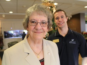 Quinte Gardens resident Patricia Dasilva, with wellness and vitality coordinator Josh Lavigne, are seen here at Quinte Gardens Friday, Dec. 19. Dasilva and Lavigne helped spread some holiday joy recently when they delivered gift baskets to local seniors in need. 
Emily Mountney-Lessard/The Intelligencer
