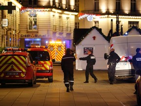 Police and rescue crews are seen near a Christmas market where a man drove a small van into a crowd, injuring ten people, including five seriously wounded, according to French media, in Nantes December 22, 2014.    REUTERS/Stephane Mahe