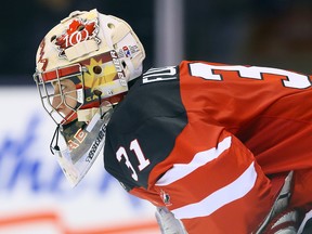Zachary Fucale of Team Canada looks up ice against Team Russia during a pre-tournament exhibition game ahead of the IIHF World Junior Hockey Championships at the Air Canada Centre in Toronto on Friday December 19, 2014. (Dave Abel/Toronto Sun/QMI Agency)