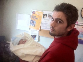 New dad Devon Fitzgerald with his son on Monday. (SUPPLIED PHOTO)