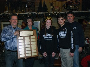 The St. Thomas Curling Club recently awarded the inaugural Ed Jermyn Rose Bowl Elementary School Champion plaque. Named in memory of a long-time icemaker at the club, the inaugural award went to a team from Elgin Court Public School. At the award presentation were curling club president Barry Westman, left, Ed's wife Cheryl Jermyn, curlers Gabrielle McSloy and Hunter Csetri and coach John Laing.  (Ben Forrest/Times-Journal)