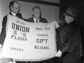 Pictured in this 1963 photograph with a 1914 St. Thomas flour bag now on display at the Elgin County Museum are, from left - St. Thomas city clerk E. C. Reid , Mayor Vincent A. Barrie, Elgin County Museum board chairman Mrs. J. R. Futcher. 
Western University Archives, London Free Press Collection