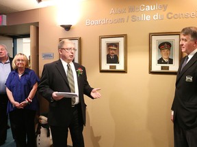 Gino Donato/The Sudbury Star                                     
Former Greater Sudbury Police Chief Alex McCauley address the crowd as police services board chair Gerry Lougheed Jr. looks on  during the naming of the fifth-floor boardroom in his honour on Monday afternoon.