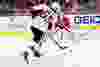 Dec 22, 2014; Washington, DC, USA; Washington Capitals goalie Braden Holtby (70) makes a save on Ottawa Senators defenseman Erik Karlsson (65) in the first period at Verizon Center. Mandatory Credit: Geoff Burke-USA TODAY Sports