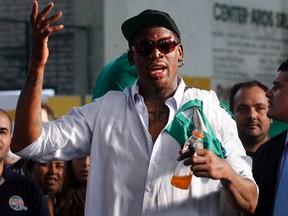 Former NBA basketball player Dennis Rodman gives a basketball clinic at Nueva Chicago sports club in Buenos Aires, March 28, 2014. REUTERS/Marcos Brindicci