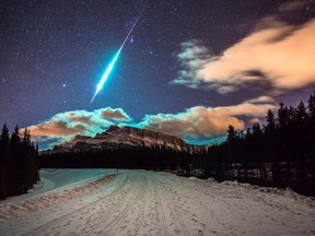Photo of a fireball exploding in the night sky over Mt. Rundle shot at 1:30 a.m. on Dec. 20, 2014Photo by Brett Abernathy