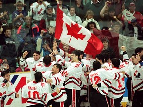 Team Canada members celebrate after winning the gold medal in Red Deer Alberta on January 4, 1995. The gold medal was the third of a five-year run. (EDMONTON SUN/QMI AGENCY)
