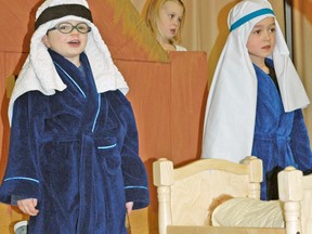 Students Nate Van Bakel (left), Emma Groenestege, and Cambell Ward in Junior and Senior Kindergarten at St. Patrick's School in Kinkora took part in their annual Christmas production last Wednesday, Dec. 17, and dressed for the nativity scene. KRISTINE JEAN/MITCHELL ADVOCATE