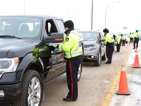 Winnipeg Police Service and RCMP members conduct a Checkstop along Highway 59 in East St. Paul earlier this month. (Brook Jones/QMI Agency file photo)