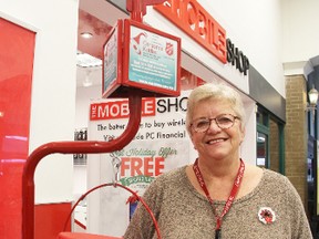 Linda Butler was volunteering at the Salvation Army kettle at the Real Canadian Superstore Tuesday. The 65-year-old Sarnia woman, who recently moved back to town from St. Thomas, says it's her first year volunteering in the campaign. TYLER KULA/ THE OBSERVER/ QMI AGENCY