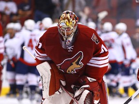 Coyotes goaltender Mike Smith reacts after giving up the game-winning goal to the Capitals in overtime on Nov 18, 2014, in Glendale, Ariz. (Mark J. Rebilas/USA TODAY Sports)