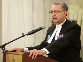 Speaker of the Alberta Legislative Assembly Gene Zwozdesky hosts the Black Ribbon Day ceremony in remembrance of those affected by the Molotov-Ribbentrop pact of 1939, at the Alberta Legislature in Edmonton Alta., on Saturday Aug. 23, 2014. David Bloom/Edmonton Sun