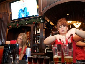 Molly Wynychuk (right) was one of the staff working during the World Juniors game between Canada and Finland on Boxing Day at Hudson's Tap House on Bourbon Street in West Edmonton Mall in Edmonton, , on Dec. 26, 2011. (EDMONTON SUN/File)