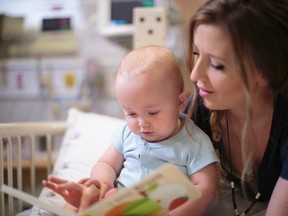 Submitted photo
Desiree Lamoureux of Chelmsford reads to her son, Taylum, who is being treated at SickKids in Toronto for a rare kidney disease.