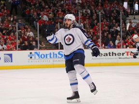 Dec 23, 2014; Chicago, IL, USA; Winnipeg Jets center Mathieu Perreault (85) celebrates scoring a goal during the second period against the Chicago Blackhawks at the United Center. Mandatory Credit: Dennis Wierzbicki-USA TODAY Sports