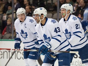 Maple Leafs forward Nazem Kadri (centre) leads teammates Dion Phaneuf (left) and James van Riemsdyk off the ice after scoring a first-minute goal against the Dallas Stars on Dec. 23, 2014. (JEROME MIRON/USA Today Sports