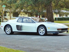 A white Ferrari Testarossa is seen in Miami, Florida, in this December 17, 2014, handout photo provided by Auto Pawn Plus. The all white 1986 Ferrari Testarossa driven by television cops Crockett and Tubbs in the hit 1980s series "Miami Vice", is being put on sale on eBay through Jan. 7 and is being offered for $1.75 million by a south Florida pawn and auto loan company.  REUTERS/Auto Pawn Plus/Handout