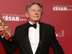 Director Roman Polanski poses with his Best Director award for "La Venus A La Fourrure" (Venus in Fur) during a photocall at the 39th Cesar Awards ceremony in Paris in this file photo taken February 28, 2014. REUTERS/Regis Duvignau/Files