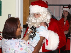 Santa greets newborn nicknamed Jack Spratt by nursing staff at Scarborough Grace on Dec. 25, 2014. (CHRIS DOUCETTE/TORONTO SUN)