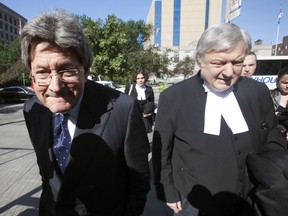Livent Inc. co-founder Garth Drabinsky arrives at the courtroom with his lawyer Edward Greenspan (R) for his sentencing hearing in Toronto August 5, 2009. (Toronto Sun files)