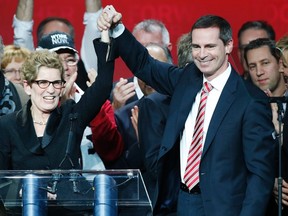Kathleen Wynne is congratulated by outgoing Ontario Premier Dalton McGuinty (R) after winning the leadership bid to become the new premier of Ontario at the Ontario Liberal leadership convention in Toronto January 26, 2013. (REUTERS/Mark Blinch)