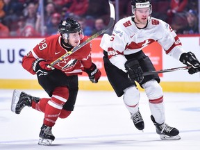Canada (29) Robby Fabbri (F) races after the puck against Switzerland (5) Muller  in the third period of the game between team Canada and team Switzerland of the 2015 IIHF World Junior Championship (exhibition game) at the Bell Center in Montreal on December 23rd  2015. (MICHEL DESBIENS/QMI AGENCY)