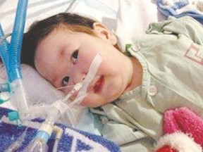 As Hunter Shannon, above, fights for life in a Hong Kong hospital, his parents are trying to raise $250,000 to fly him to Australia for care. (Special to The Free Press)
