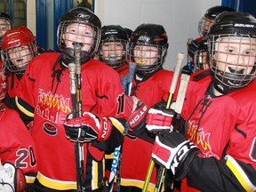 Members of the Aylmer Flames atom minor hockey team prepare to take on the West Lorne Comets in Alvinston on Friday afternoon. The Flames defeated the Comets 7-1 in a C division game at the 25th annual atom regional Silver Stick tournament in Alvinston. (TERRY BRIDGE/THE OBSERVER)