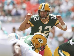 Packers quarterback Aaron Rodgers purchased gifts for his linemen and he’ll aim to give his Green Bay team the NFC North title with a win over the visiting Detroit Lions on Sunday. (GETTY IMAGES)