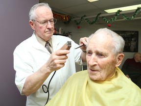 Gino Donato/The Sudbury Star
Gene Byers, who recently hung up the scissors after decades of barbering, gives longtime customer David Chapman a trim.