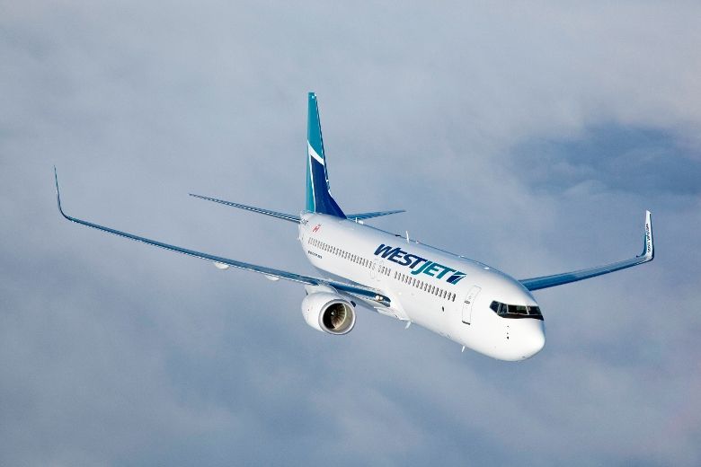 WestJet to charge for first checked bag across international network