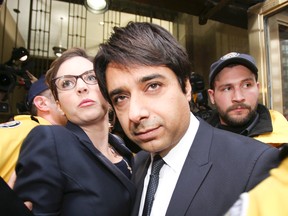 Jian Ghomeshi leaves College Park Courts  on Wednesday, Nov. 26, 2014. (Veronica Henri/QMI Agency)