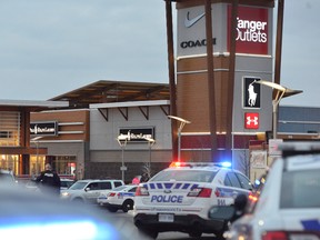 Police close the perimeter of Tanger Outlets Mall in Kanata where a shooting occurred on Friday, Dec. 26, 2014. Ottawa police are working hard to make arrests in the case.
Matthew Usherwood/Ottawa Sun