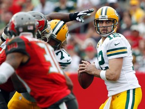 Green Bay Packers quarterback Aaron Rodgers (12) throws the ball against the Tampa Bay Buccaneers during the first half at Raymond James Stadium on Dec 21, 2014 in Tampa, FL, USA. (Kim Klement/USA TODAY Sports)