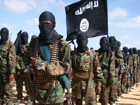 A file photo taken on February 13, 2012 shows Somali al Shabaab fighters gathering in Elasha Biyaha, in the Afgoei Corridor, after a demonstration to support the merger of al Shabaab and the Al-Qaida network. (AFP PHOTO/Mohamed Abdiwahab)