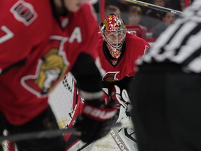 Craig Anderson braces for the faceoff during NHL action in Ottawa Saturday between the Senators and Red Wings. (Tony Caldwell/Ottawa Sun)