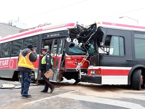 A TTC bus and streetcar collide at Main St. and Danforth Ave. on Dec. 27, 2014. (John Hanley/Special to the Toronto Sun)