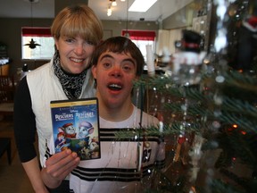 Michelle Nielsen, son Kyle and their copy of Disney film The Rescuers which he got for Christmas courtesy of an anonymous donor.
DOUG HEMPSTEAD/Ottawa Sun/QMI AGENCY