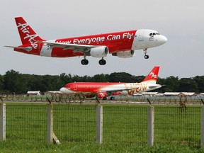 An AirAsia Airbus A320 passenger jet lands at Sukarno-Hatta airport in Tangerang on the outskirts of Jakarta in this Jan. 30, 2013 file picture. REUTERS/Enny Nuraheni/Files